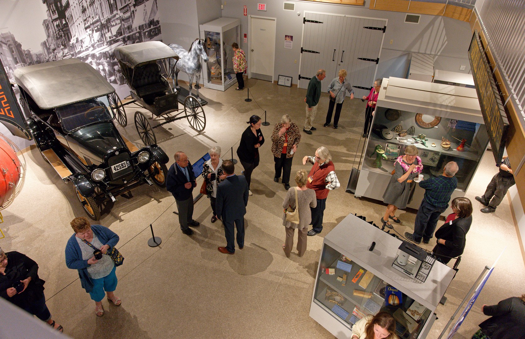 Group gathered in large museum gallery.